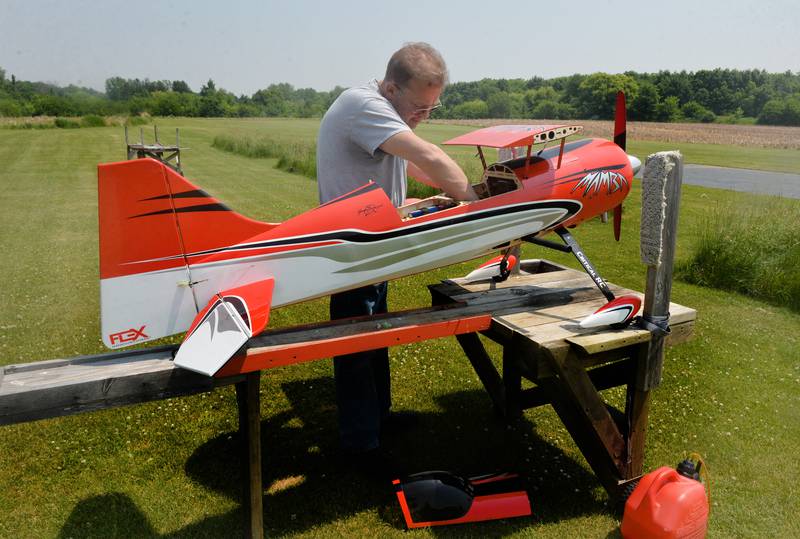 Rich Nerstheimer of Rock Falls prepares his model aircraft for flight at the Morrison Model Aircraft Flyers area inside Morrison-Rockwood State Park on Sunday, June 4. Sunday's warm and sunny skies made for a good day of flying for club members.