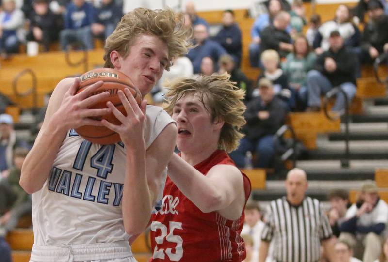 Bureau Valley's Juston Moon grabs a rebound over Hall's Wyatt West on Friday, Jan. 19, 2024 at Bureau Valley High School.