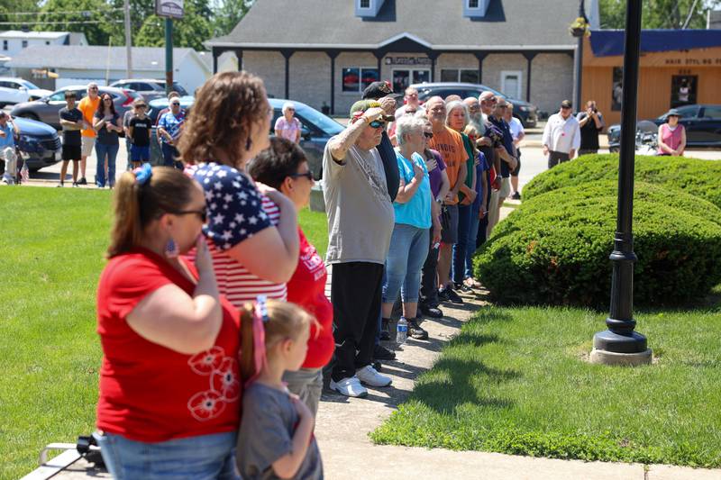 Attendees stand for the playing of "Taps" and a rifle salute during the Bradley American Legion's Memorial Day ceremony on Monday, May 25, 2026.