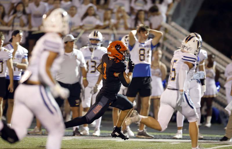Wheaton Warrenville South's Owen Yorke (3) heads towards the end zone for a touchdown Friday, Oct. 3, 2025 at Red Grange Field in Wheaton.