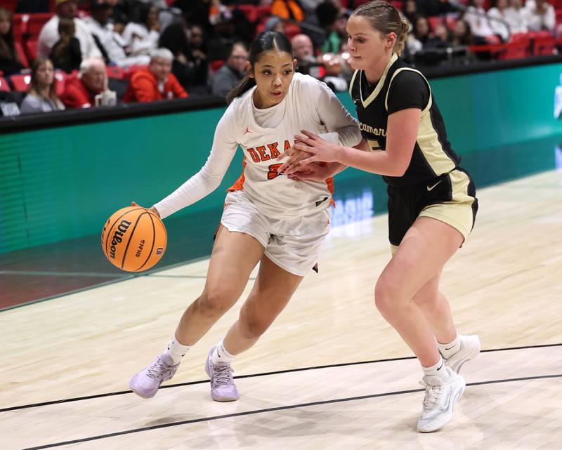 DeKalb's Alicia Johnson drives against Sycamore's Grace Amptmann Friday, Jan. 30, 2026, during their game in the FNBO Challenge in the Convocation Center at Northern Illinois University in DeKalb.