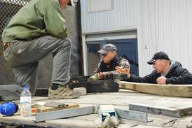 Lanark First Brethren and friends help repair truck for Fellowship of Christian Farmers International