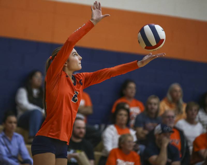 Oswego's Avery Borowski (2) serves during volleyball match between Romeoville at Oswego. Oct 16, 2025.