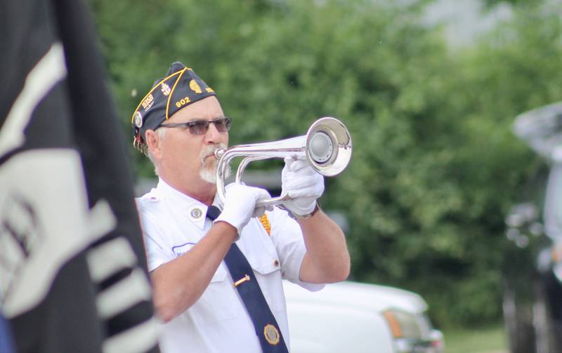 John Roush played the bugle call for taps on Monday, May 29, 2023, during a Memorial Day observance along the Rock River in rock Falls.
