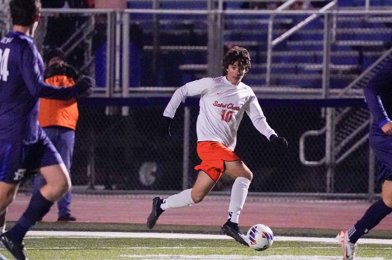 St. Charles East's Giuseppe Avendano (10) moves the ball up the field during a class 3A St. Charles North Boys Soccer Supersectional match against New Trier at St. Charles North High School on Wednesday, Nov. 1, 2023.