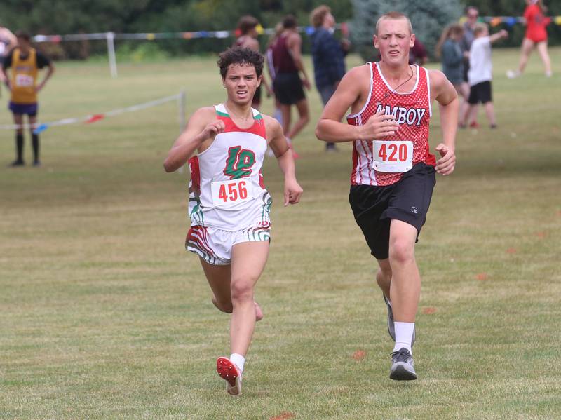 L-P's Darius Mayhew and Amboy's Aaron Costner compete during the Gary Coates Invitational cross country meet on Saturday, Sept. 13, 2025 at Zearing Park in Princeton .
