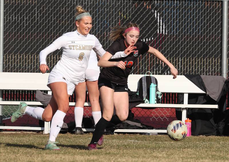 Plainfield East's Violet Meija pushes the ball ahead of a Sycamore player during their game Tuesday, March 25, 2025, in the Barb Fest tournament at DeKalb High School.