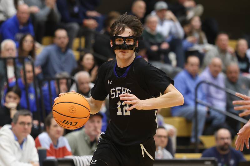 St. Francis’ Tanner Hozian looks to make a play against Lemont in the Class 3A Hinsdale South Regional semifinal game on Tuesday, March 3, 2026 in Darien.