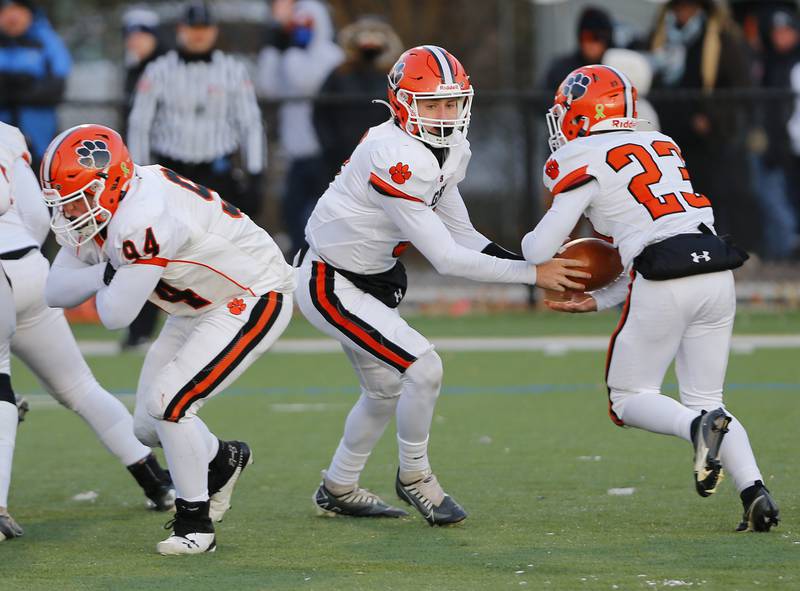 Byron's Jacob Ross (23) takes a handoff during the Class 3A varsity football semi-final playoff game between Byron High School and IC Catholic Prep on Saturday, Nov. 19, 2022 in Elmhurst, IL.