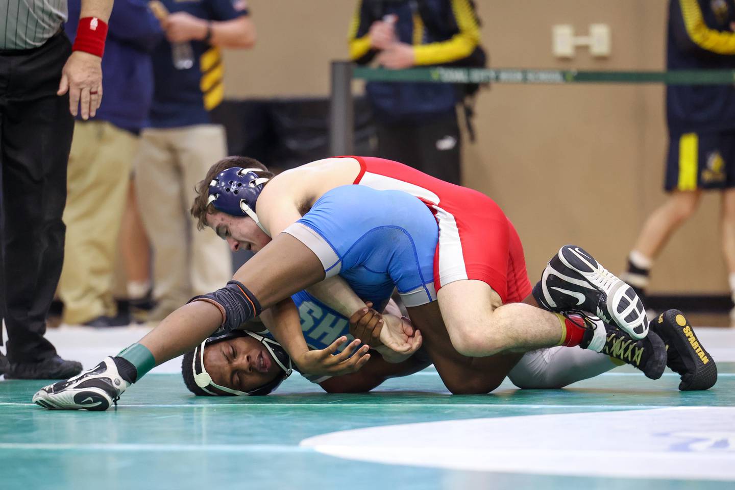 Peotone's Jonah Young, bottom, wrestles Lisle's Alexander Farari in the 126-pound third place match during the IHSA Class 1A Coal City Sectional on Saturday, Feb. 14, 2026.