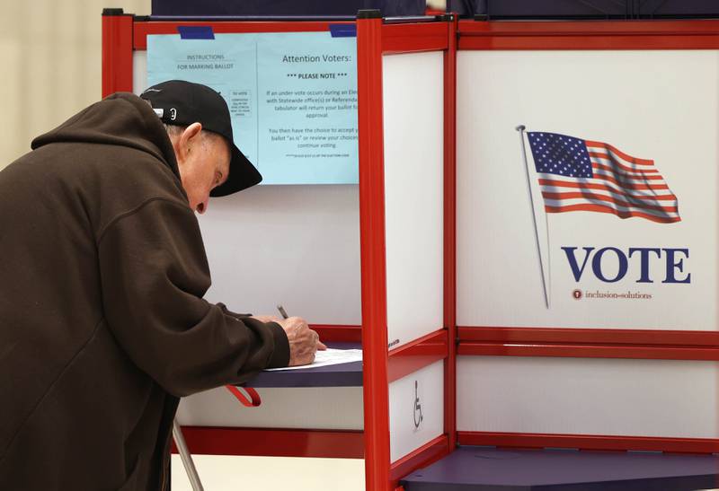 Richard Finnestad, from DeKalb, casts his ballot Tuesday, Nov. 5, 2024, Election Day, at the DeKalb Public Library.