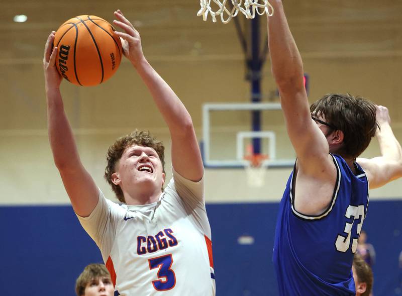 Genoa-Kingston's Jack Peterson goes to the basket against Hinckley-Big Rock's Marshall Ledbetter Tuesday, Jan. 6, 2026, during their game at Genoa-Kingston High School.