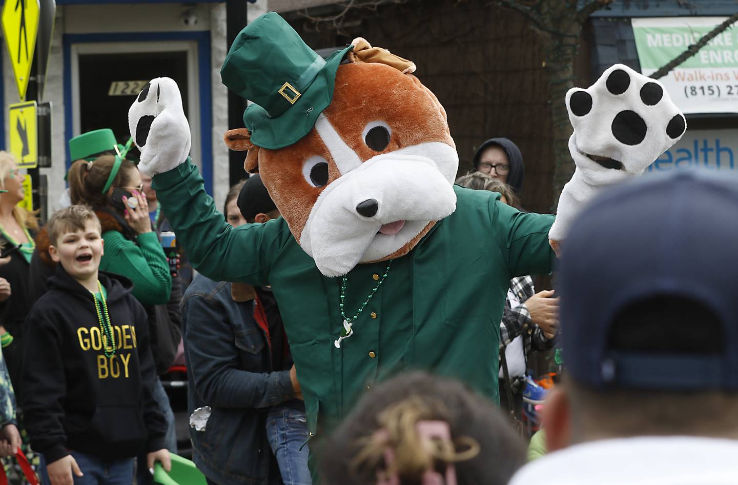 A dog mascot entertains the crowd during the McHenry ShamROCKS the Fox Festival Parade on Saturday, March 16, 2024.