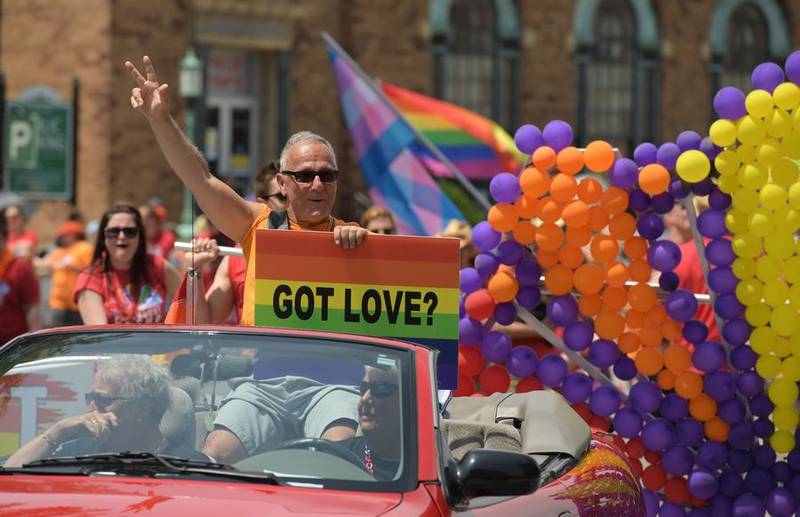 Jim Corti, artistic director of the Paramount Theater, leads the inaugural Aurora Pride parade in June 2018.