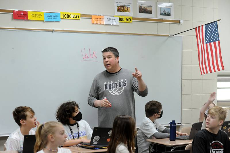 Teacher Ryan Starnes talks to students Friday, April 29, 2022, as he teaches his social studies class at Marlowe Middle School. Several Huntley School District 158, classes have raised money for philanthropy causes.