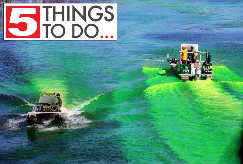 Crews dump dye into the Fox River near the Pearl Street Bridge during the ShamROCKS the Fox festival in McHenry on Saturday, March 12, 2022.