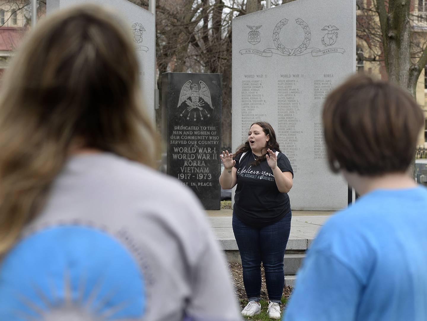Dana Wright, a legal advocate with Safe Journeys, speaks to the crowd Saturday, April 23, 2022, at Washington Square in Ottawa before they begin their walk during the March to Believe event.