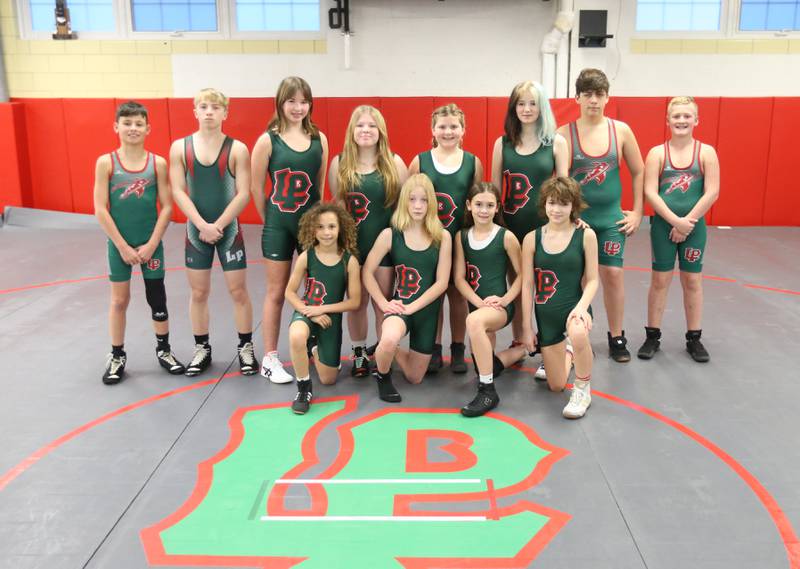 Members of the LP Crunching Cavs Youth Wrestling Club pose for a photo on Tuesday, March 5, 2024 at L-P High School. This year twelve qualifiers have advanced to state.
