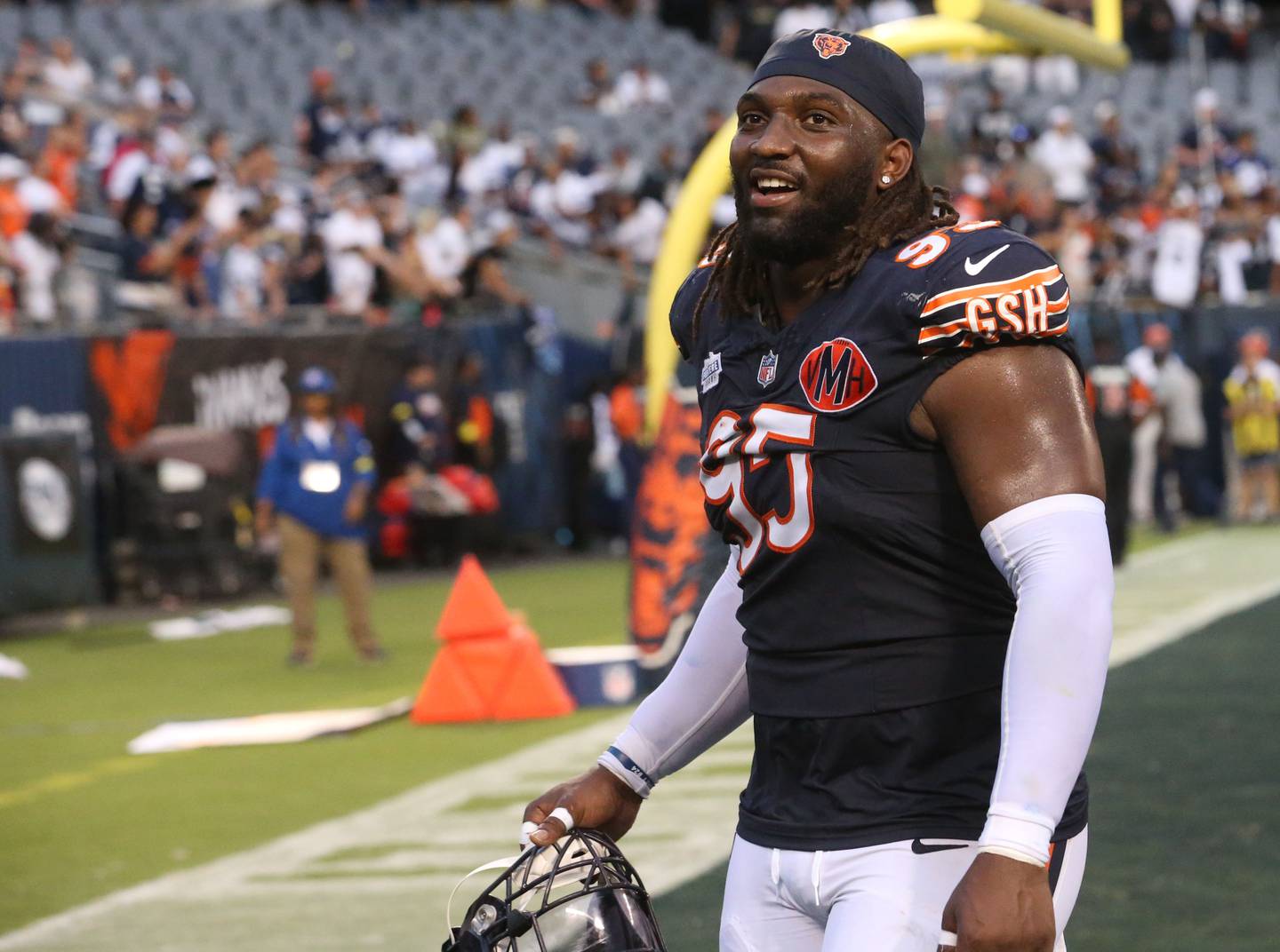 Chicago Bears defensive lineman Shemar Turner smiles while walking off of the field after getting a win against the Dallas Cowboys on Sunday, Sept. 21, 2025 at Soldier Field.