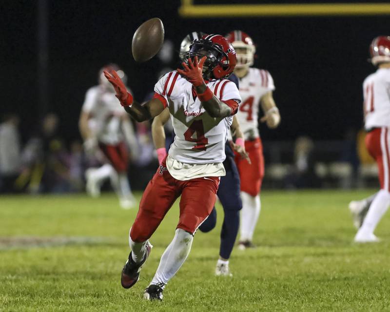 Yorkville's Jayden Ruth (4) fields a punt off of a bounce during football game between Yorkville at Oswego East Friday, Oct 10, 2025 in Oswego.