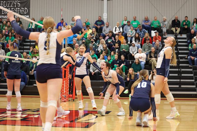 Cissna Park's Ella Schluter and teammates turn to celebrate a point earned by Sophie Duis during the Timberwolves' victory in two sets, 25-22, 25-11, over Windsor/Stewardson-Strasburg in the IHSA Class 1A Heyworth Super-Sectional on Monday, Nov. 10, 2025.