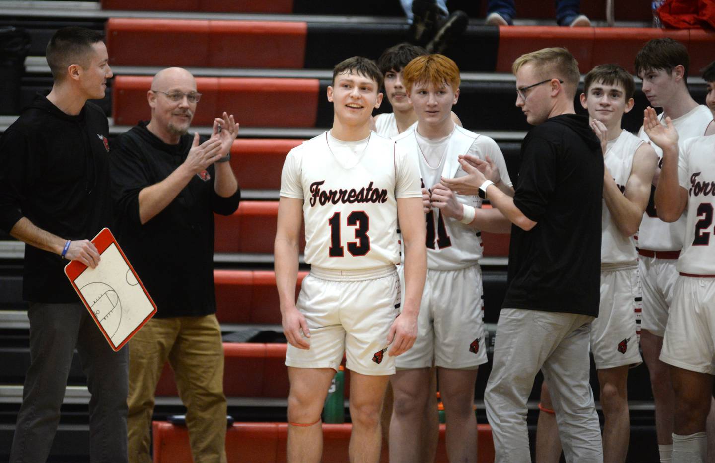 Forreston's Kendall Erdmann (13) scored his 1000th point on Saturday, Feb. 8, 2025 against Morrison and received accolades from fans, coaches and his teammates. The junior reached the milestone in the fourth quarter, scoring a total of 26 points in the Cardinals' 70-49 over the Mustangs.