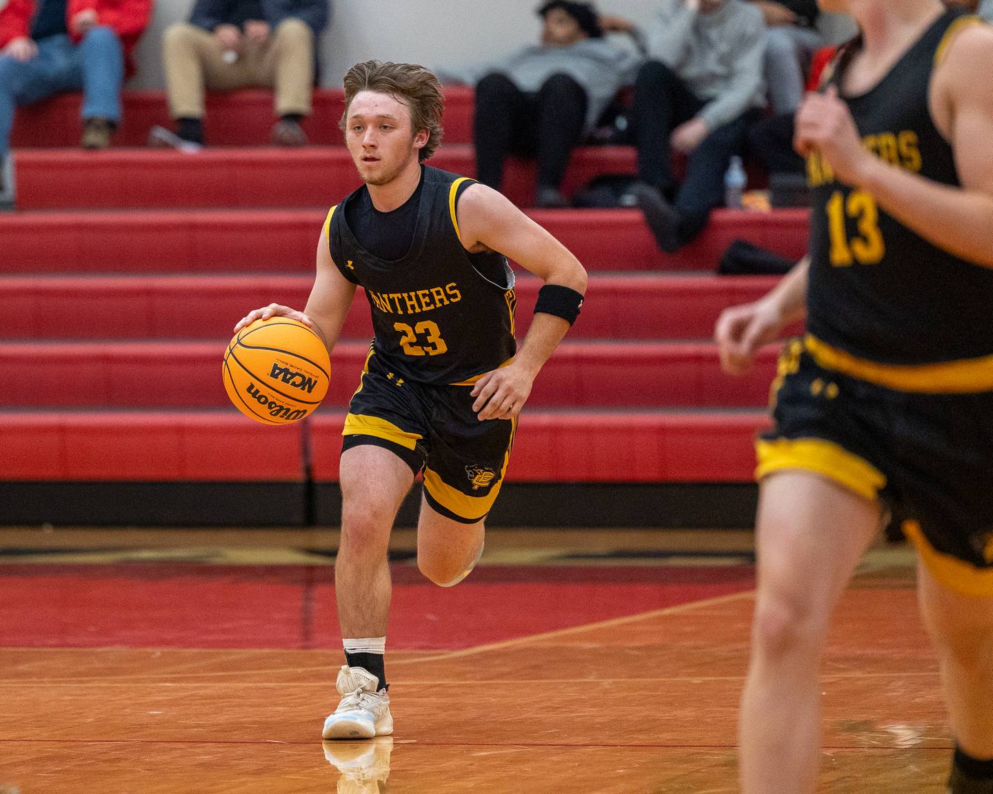 Braden Bickerman (23) of Putnam County dribbles ball down court during the Colmone Classic on Monday, December 8, 2025 at Hall High School in Spring Valley.