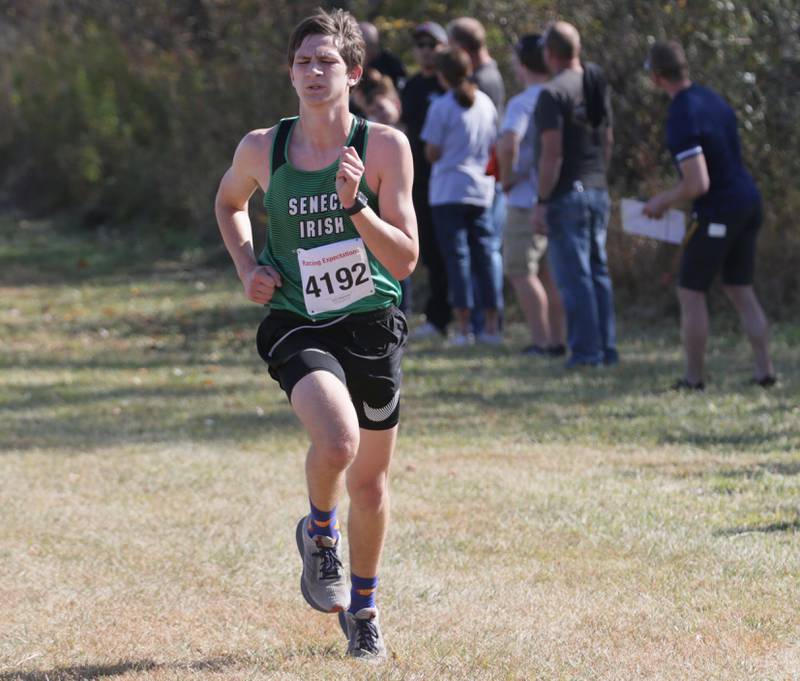 Seneca's Calvin Maierhofer runs in the Class 1A Regional Cross Country boys race on Saturday, Oct. 22, 2022 at the Seneca FFA Farm in Marseilles.