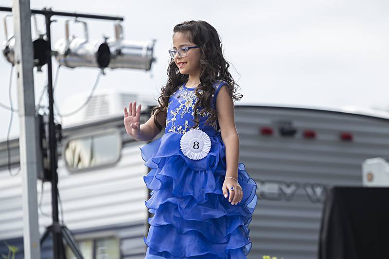 Lydia Valenzuela waves Wednesday August 2, 2023 during the Young Miss Ogle County pageant.