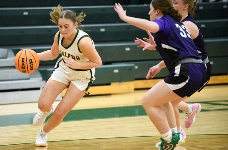 Coal City’s Kylee Kennell, left, works her way around Manteno’s Brooke Blanchette during Monday’s game at Coal City. Kennell hit a buzzer-beater to give the Coalers a 40-38 win.
