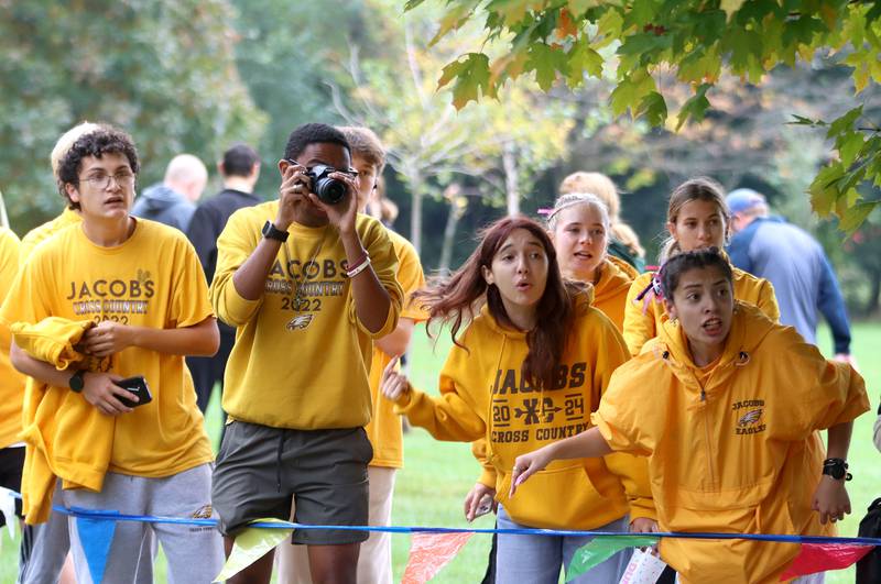 Jacobs fans cheer girls runners during the Fox Valley Conference Cross Country Meet at McHenry County College in Crystal Lake on Saturday, October. 18, 2025.