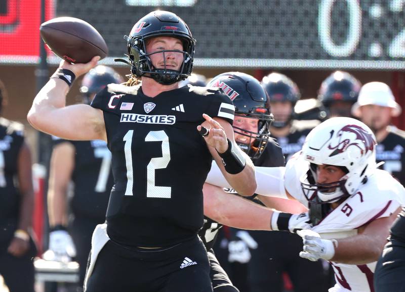 Northern Illinois' Rocky Lombardi gets off a pass just before being hit by Southern Illinois' Tim Varga during their game Saturday, Sept. 9, 2023, in Huskie Stadium at NIU in DeKalb.