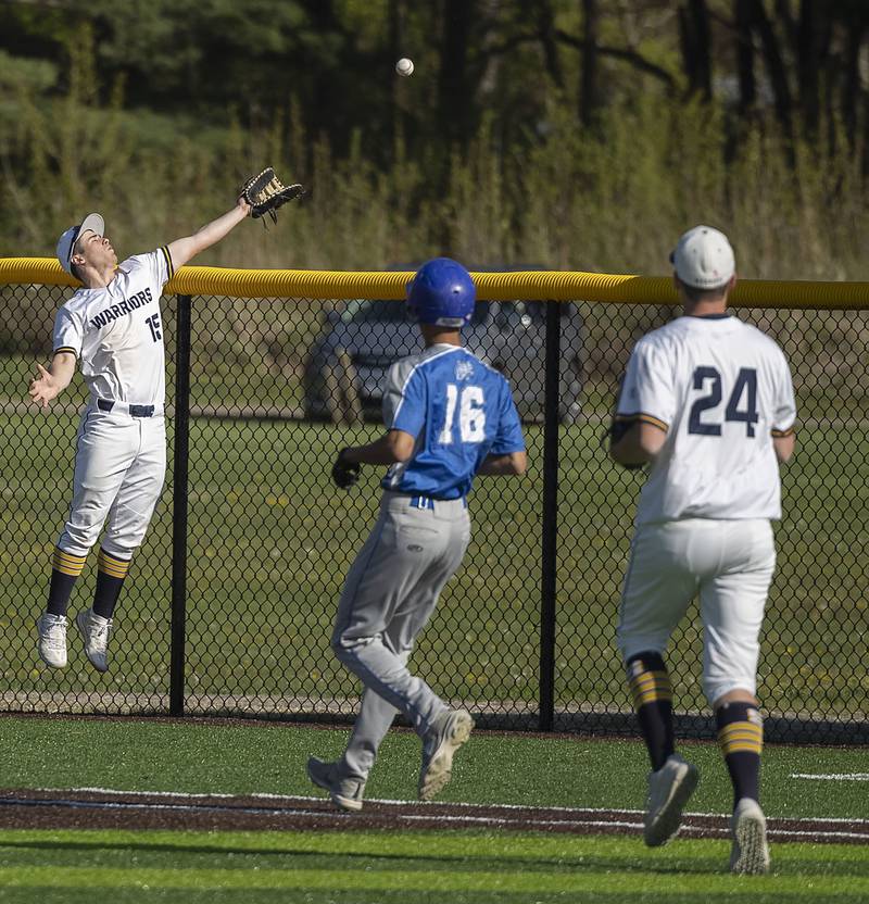 Sterling’s Mason Smithee reaches up can’t make a foul ball catch against Newman Wednesday, May 3, 2023.