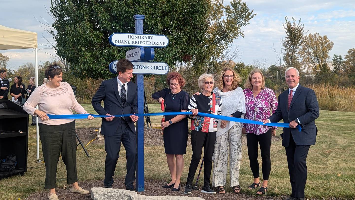 Lightways Hospice and Serious Illness Care in Joliet dedicated its drive to former CEO Duane Krieger of Shorewood on his 88th birthday, Tuesday, October 22, 2024. Pictured from left are Will County Executive Jennifer Bertino-Tarrant, Douglas Krieger (Duane Krieger's son), Lightways CEO Mary Kay Sheehan, Diane Welch (Duane Krieger's daughter), Danette Krieger (Duane Krieger's daughter) and Joliet Mayor Terry D’Arcy.