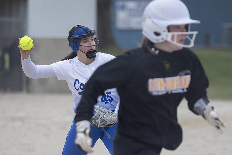 Newman’s Gianna Vance throws to first for an out against Lena-Winslow Wednesday, April 1, 2026.