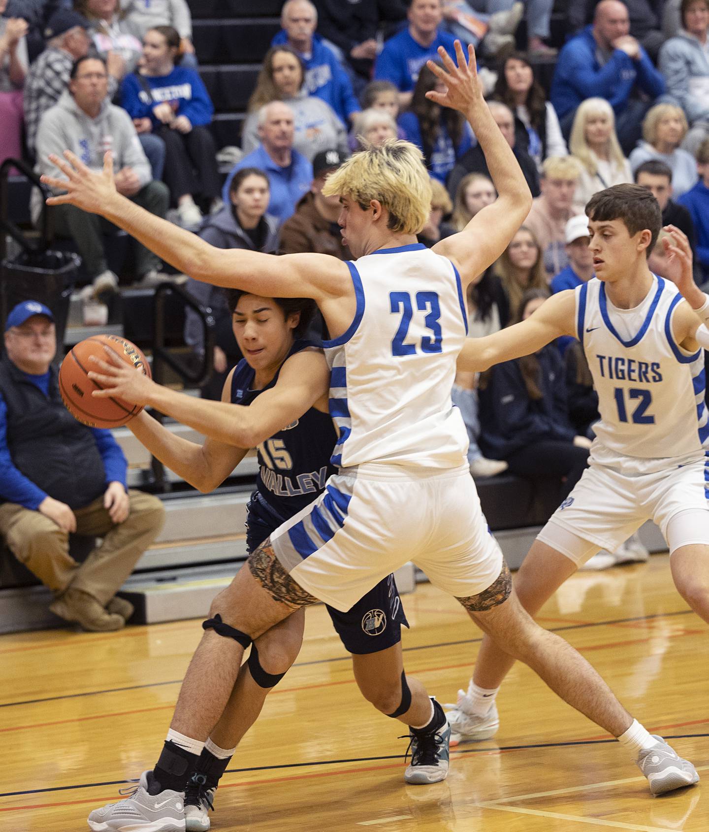Bureau Valley’s Corban Chhim looks to pass while being guarded by Princeton’s Noah LaPorte Wednesday, Feb. 21, 2024 at the Prophetstown class 2A basketball regional.