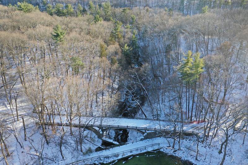 An aerial view of the snowfall on the bridge over the Lake Falls area at Matthiessen State Park on Monday, Nov. 27, 2023 near Oglesby.