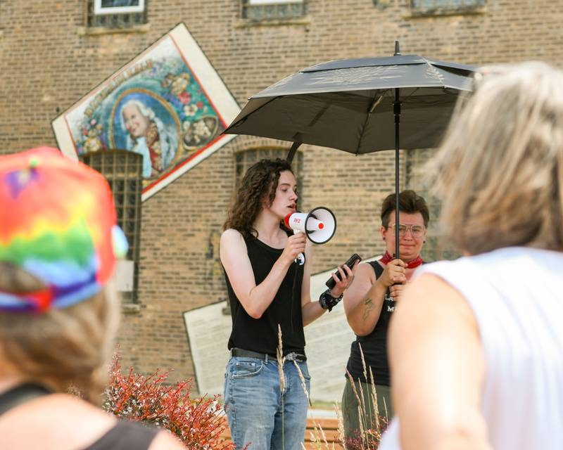 Nikki Gudmunson, 18, of Sycamore, and with nonprofit Youth Outlook, speaks during a Trans Resilience Rally held on Sunday, June 22, 2025, in downtown DeKalb. Organizers said the rally was to show public support for people they believe are unjustly and harmfully targeted under President Donald Trump's policies.