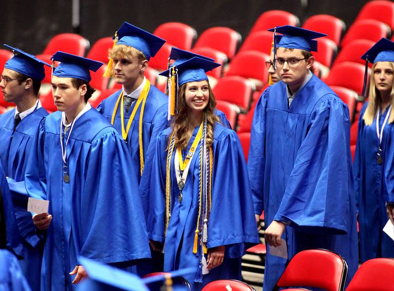 Geneva High School graduate Julianna Longo (center) enters the Northern Illinois University Convocation Center in DeKalb for the school’s 2022 Commencement Ceremony on Tuesday, May 31, 2022.