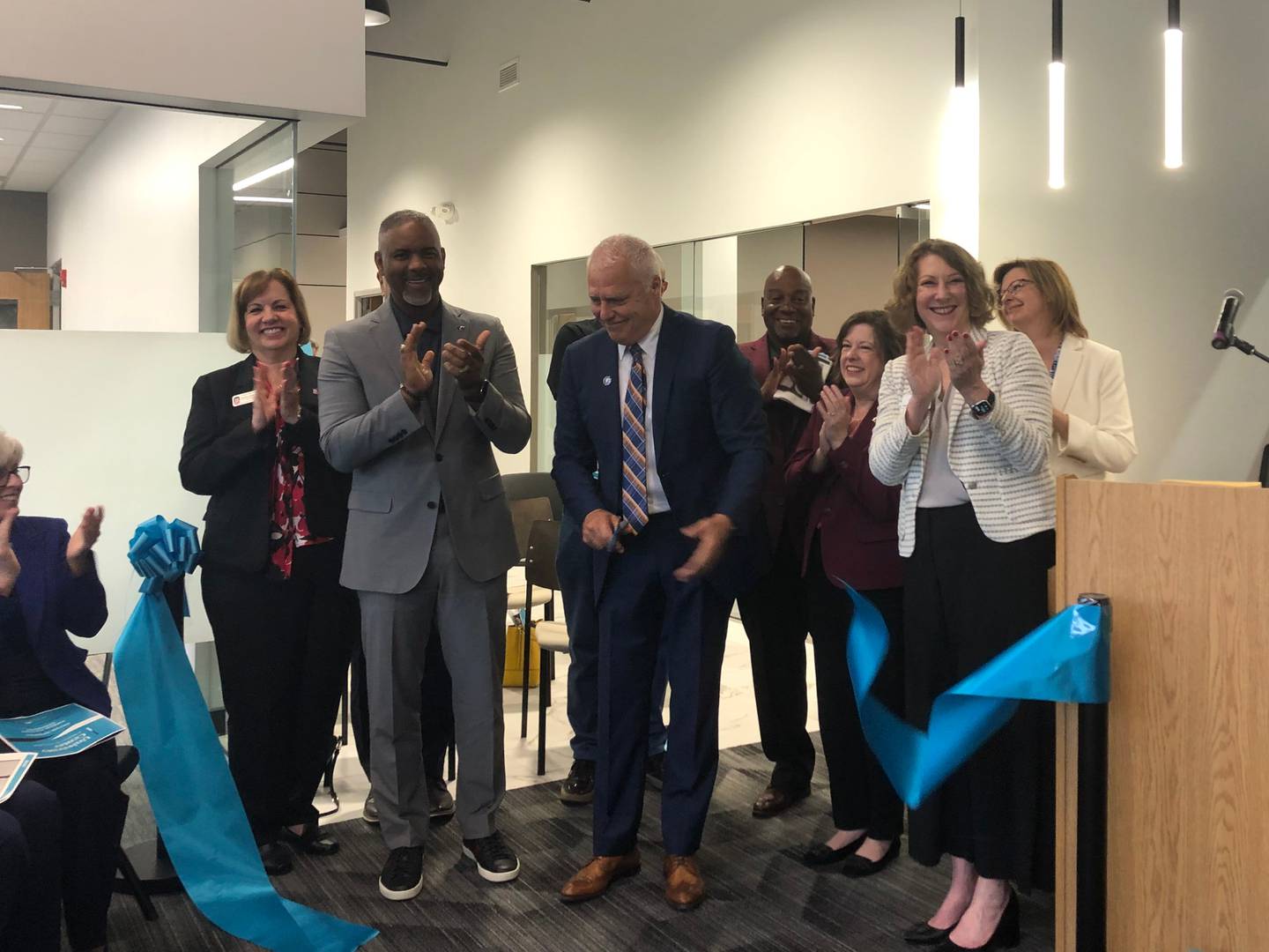 McHenry County College President Clint Gabbard cuts the ribbon on the McHenry County College University Center in Woodstock Aug. 1, 2024.
