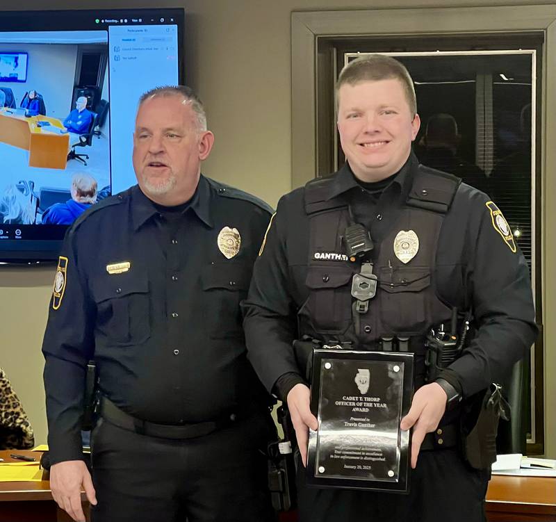 Sterling Police Department's Deputy Chief Pat Bartel stands with SPD Officer Travis Ganther who was presented with the SPD's Officer of the Year award during a Sterling City Council meeting on Monday, Jan. 21, 2025.