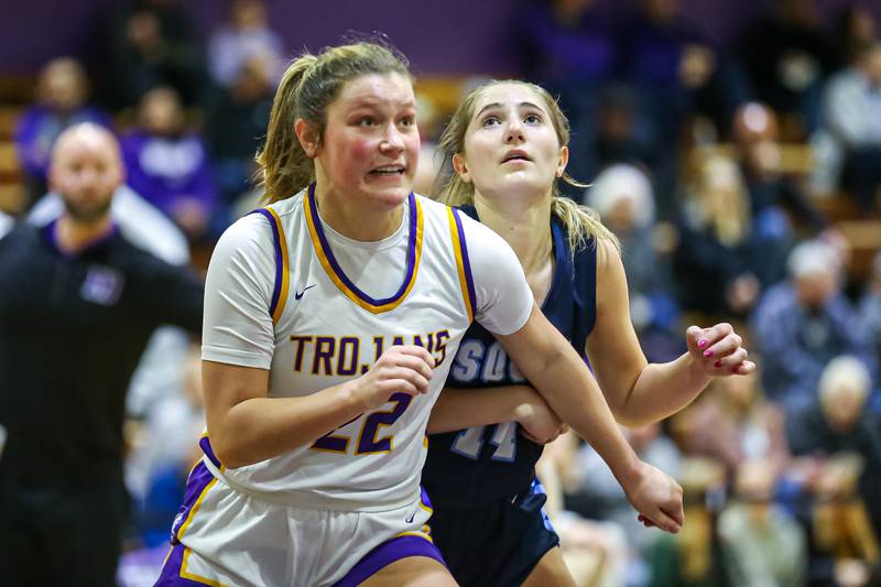 Downers Grove North's Lilly Boor (22) blocks out Downers Grove South's Allison Jarvis (14) at the free throw line during girls basketball game between Downers Grove South at Downers Grove North. Dec 16, 2023.