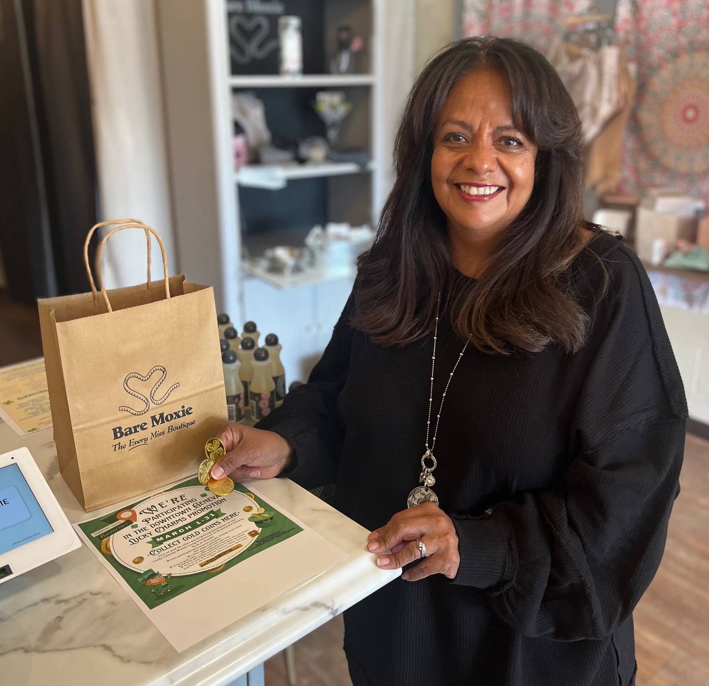 JoAnn Salazar, owner of Bare Moxie Bra & Swim Boutique, 115 W. State St., Geneva, is one of 35 businesses participating in the Lucky Charms Promotion through March 31.
