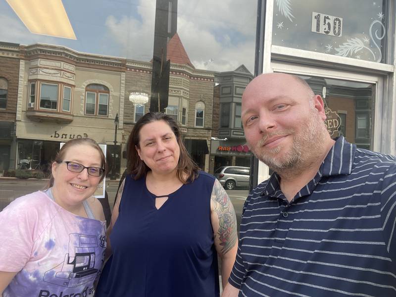 Business partners Willy Adkins (right), Shoobie Shirley and Becky Lange pose in front of 150 E. Lincoln Highway, downtown DeKalb, the location of their new shop Mr. Willy's Dark Art and Oddities, slated to open in October 2025.