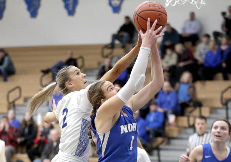 St. Charles North’s Reagan Sipla (left) and Wheaton North’s Zoey Bohmer (right) go for the rebound during the Class 4A St. Charles North Regional final on Thursday, Feb. 16, 2023.