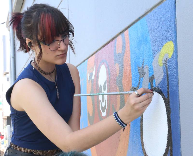 Jay McConnll a student at La Salle-Peru Township High School draws a musicians’ mural on an exterior wall on Tuesday, May 23, 2023 at Nicks on 6 in La Salle. L-P students worked on a community outreach project to create four murals immortalizing local musicians, on the corner of Bucklin Street and U.S. 6, which houses Nick’s on 6.