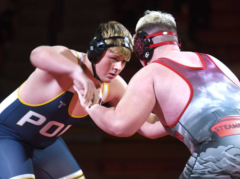 Polo's Maddox Peterson (left) and Jack Holmbo start their 285-pound match during a triangular meet at Oregon High School on Thursday, Dec. 4, 2025.