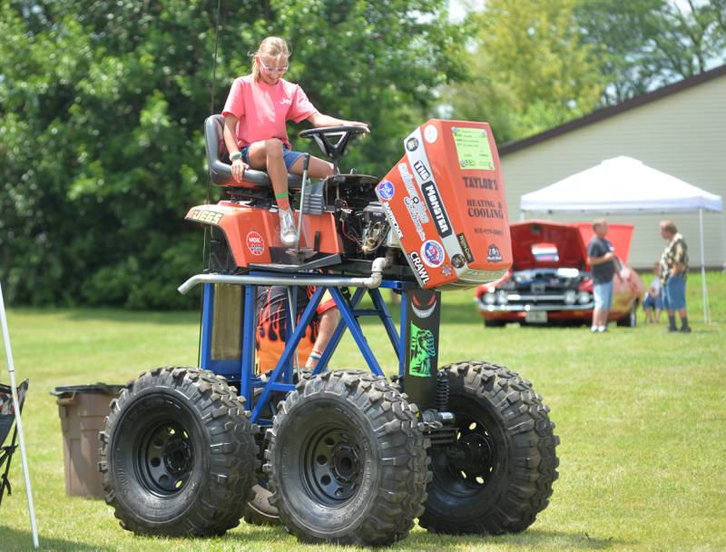 Kinsey Ward of Byron sits in Dale Echelbarger's 1986 Simplicity "Monster" at the 34th Annual Hib Reber Memorial Car Show in Byron on Saturday, July 12, 2025.