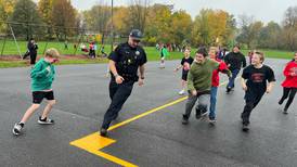 Mendota police, firefighters play kickball games with students