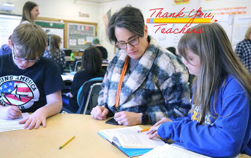 Mary Lynn Buckner, longtime educator at Littlejohn Elementary School, supports Nicole Schmidt's fifth-grade class during their individual work time Tuesday, March 14, 2023, at the school in DeKalb.